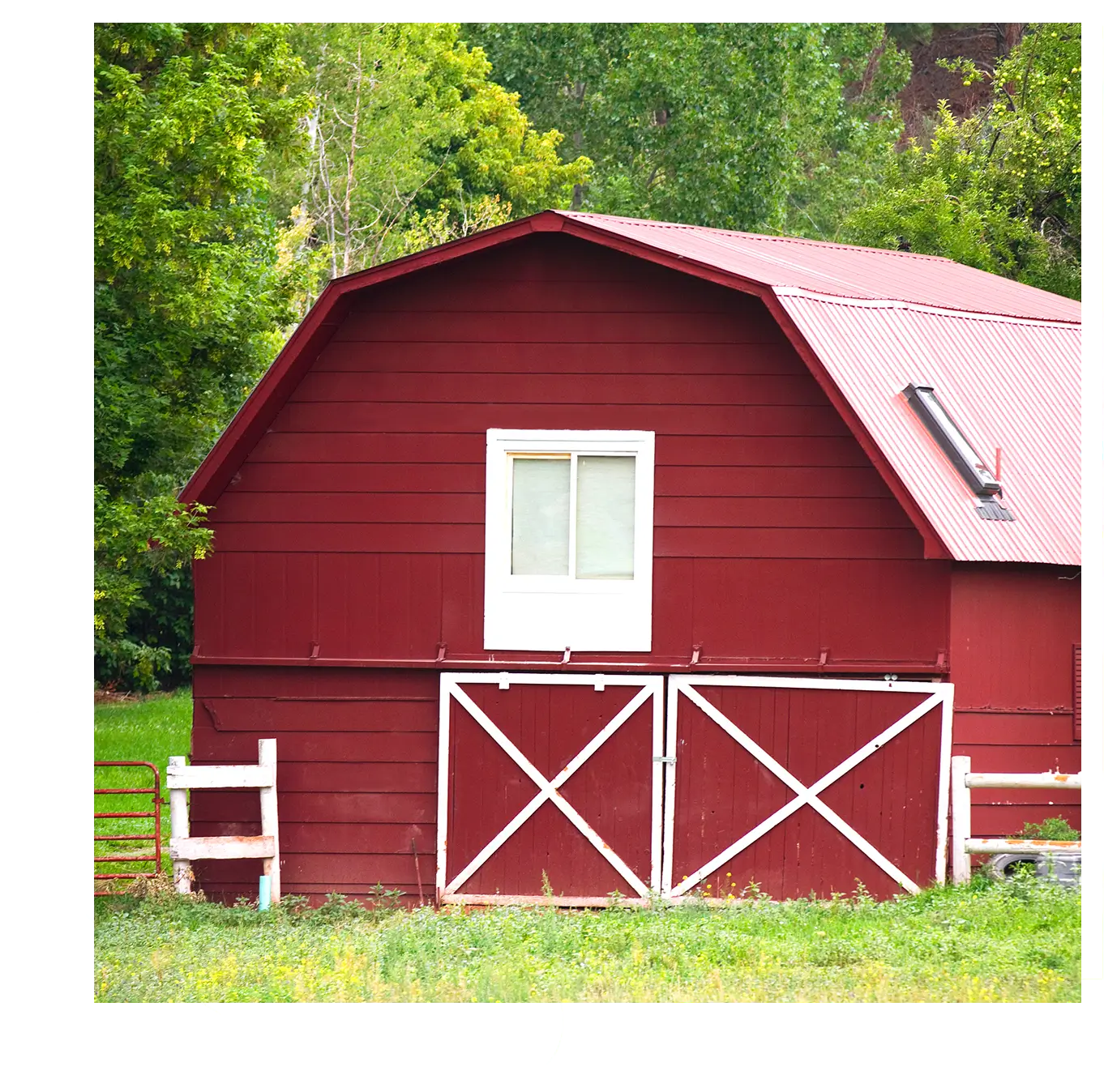 Red barn with white doors and window.