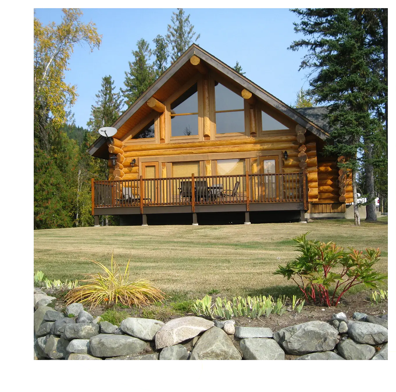 Rustic log cabin with deck.